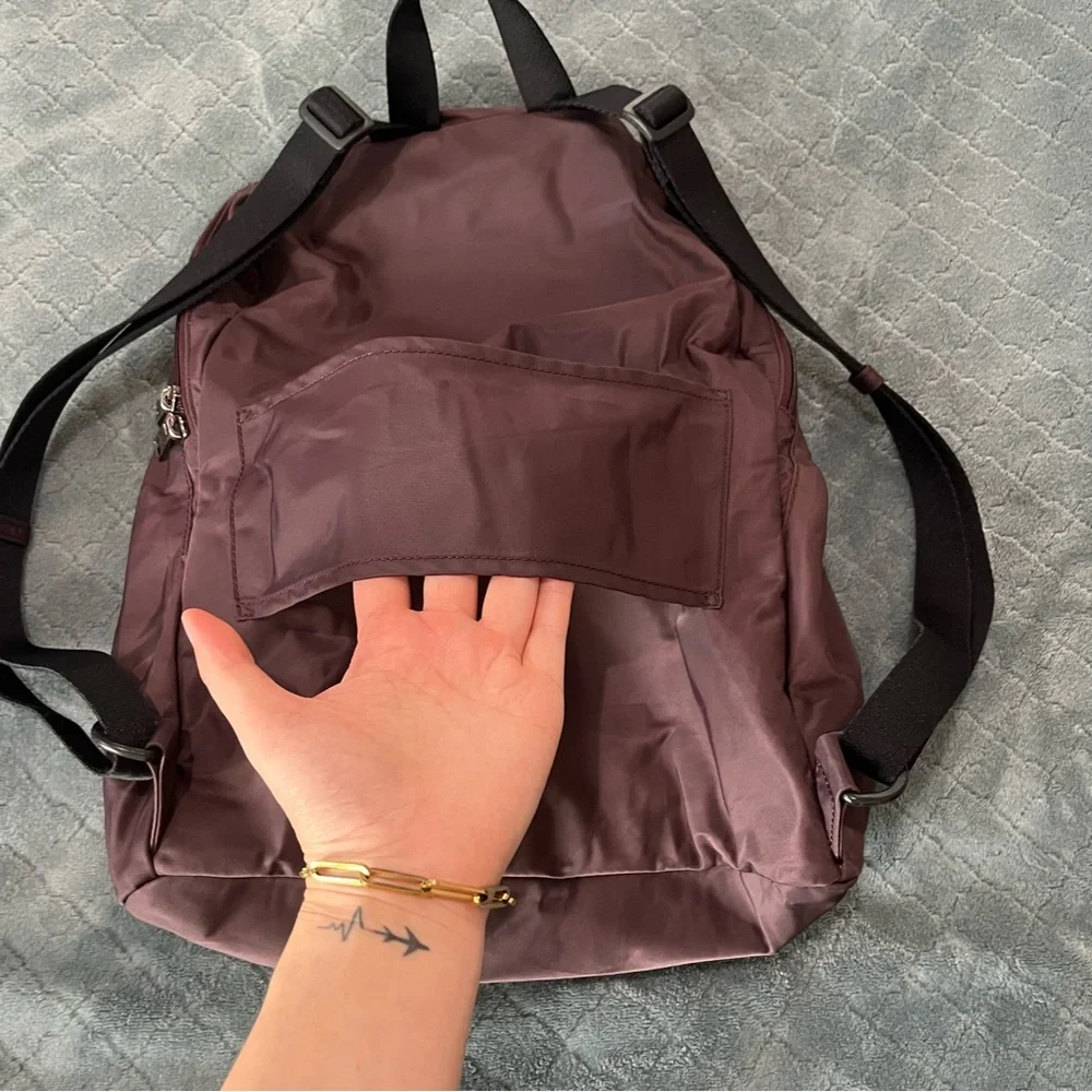 Tumi‎ maroon Backpack with Classic Design and Durable Build